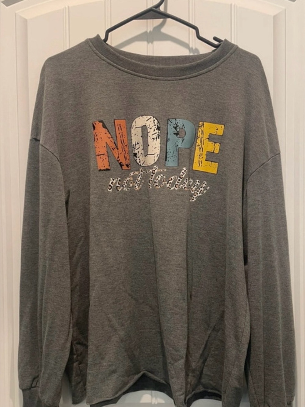 Women’s sweatshirt with “Nope Not Today”
graphics